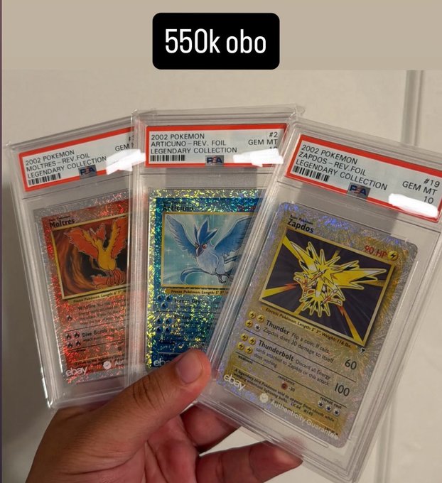 A hand holds three PSA-graded 2002 Pokemon Legendary Collection reverse holo cards: Moltres #19, Articuno #2, and Zapdos #19, all graded GEM MT 10, with text overlay reading '550k obo'.