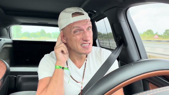 A man wearing a white cap and t-shirt sits in the driver's seat of a car, touching his ear with a wide, exaggerated expression on his face. The post references a YouTube video titled "Bitcoin: my final video" with a shortened link, suggesting the man in the image is likely the creator announcing or discussing his final thoughts on Bitcoin in that video.