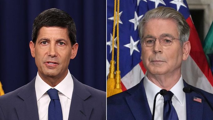 A side-by-side comparison of two men in dark suits, one with short dark hair and the other with gray hair and glasses, both appearing to be U.S. political figures.