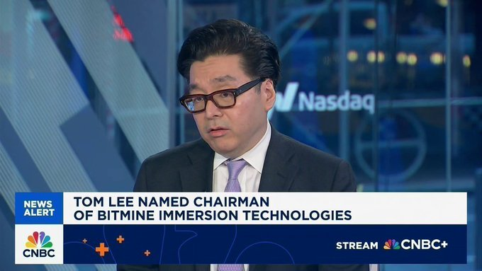 A CNBC news broadcast features Tom Lee wearing glasses and a dark suit with a purple tie, appearing as a guest on the program. The on-screen graphic reads "TOM LEE NAMED CHAIRMAN OF BITMINE IMMERSION TECHNOLOGIES," with the Nasdaq logo visible in the background. The image relates to the accompanying post by highlighting Tom Lee's role with Bitmine ($BMNR) as they report updated cryptocurrency and investment holdings, such as their 212 Bitcoin ($BTC) holdings, 5.98 million Ethereum ($ETH), and stakes in Eightco ($ORBS) and Beast Industries.