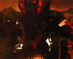 The image shows a scene from an anime or video game where a black dragon, possibly made of rock or metal, is surrounded by a red fire burning at its base. The dragon's mouth appears as sharp teeth and its head is twisted towards the viewer. In addition, there are other elements such as two more dragons (one standing behind the main one) and a person standing in front of them with their arms crossed. The post reading "LIT +50% and the entire world goes to LITERAL ZERO" suggests that this scene might be from an alternate reality or a fantastical setting, where everything follows a similar pattern.