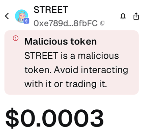 A cryptocurrency interface warning about 'STREET' token labeled 'Malicious token' with address '0xe789d...8fbFC' and a price of '$0.0003'.