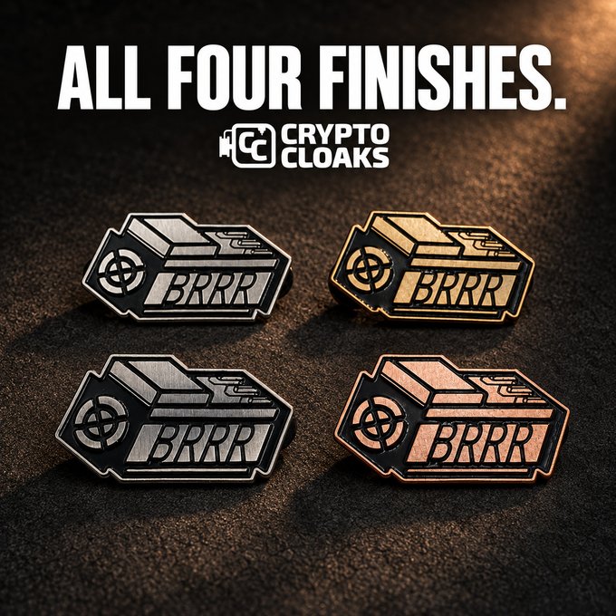 A promotional image displays four enamel pins labeled "BRRR" for "CRYPTO CLOAKS" in different metallic finishes: silver, gold, antique silver, and copper.