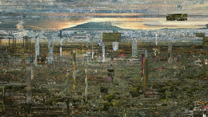 A heavily glitched and pixelated landscape image appears to show a mountain in the distance behind a distorted, fragmented foreground of what may be a town or industrial area.