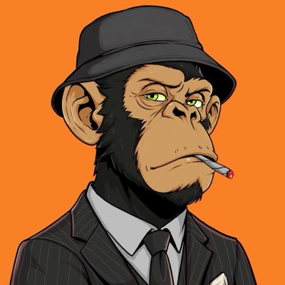 A cartoon chimpanzee wearing a pinstripe suit, tie, and fedora hat smokes a cigarette against an orange background, perfectly matching the "monkey business" and "SuitUp" hashtags with its sharp, business-like attire.