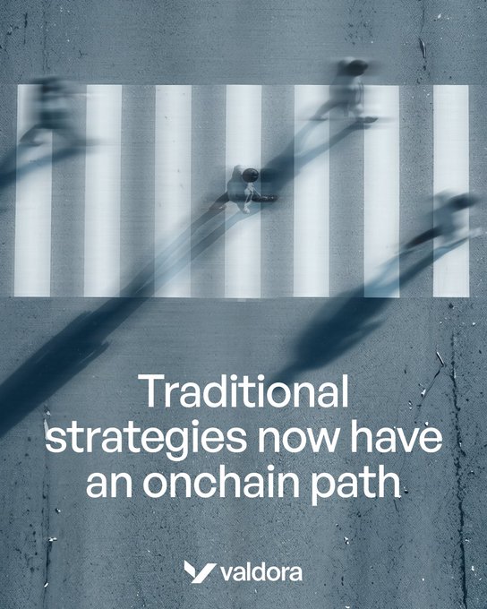 A dark promotional image showing an aerial view of a crosswalk with people walking, overlaid with the text 'Traditional strategies now have an onchain path' and the Valdora logo.