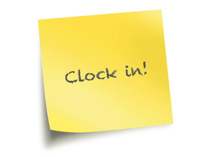 A yellow sticky note with handwritten text reading 'Clock in!' on a white background.