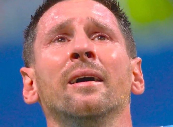 A close-up photo of a sweating man with a surprised or emotional expression.