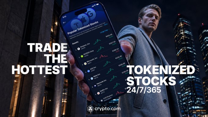 A businessman in a suit holds up a smartphone displaying the Crypto.com app's "Popular Tokenized Stocks" feature, showing tickers like Tesla, Apple, NVIDIA, Microsoft, and Amazon with prices in euros. Bold text overlays read "TRADE THE HOTTEST TOKENIZED STOCKS 24/7/365," promoting access to U.S. equities through tokenization. The Crypto.com logo and website appear at the bottom against a nighttime cityscape backdrop, aligning with the post's message of trading tokenized U.S. stocks 24/7 from Europe with zero commission.