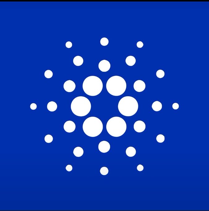 The Cardano (ADA) cryptocurrency logo, featuring a pattern of white circles arranged in a circular design on a blue background.