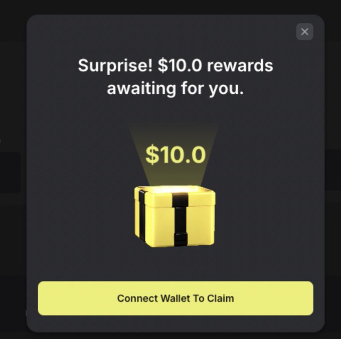 A pop-up notification promises "Surprise! $10.0 rewards awaiting for you" above a glowing gift box showing "$10.0", with a yellow "Connect Wallet To Claim" button at the bottom. The ad promotes @predofficial's Surprise Box feature on pred.app, where users can enter their wallet address for a chance to receive a reward, reinforcing the call-to-action with a limited-time gift alert.