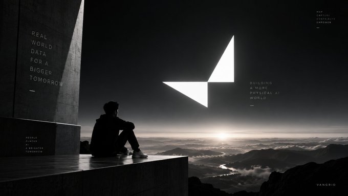 A digital artwork shows a silhouette of a person sitting on a building ledge overlooking a misty mountain landscape at sunset, with text including 'REAL WORLD DATA FOR A BIGGER TOMORROW' and 'BUILDING A MORE PHYSICAL AI WORLD', labeled 'VANGRID'.
