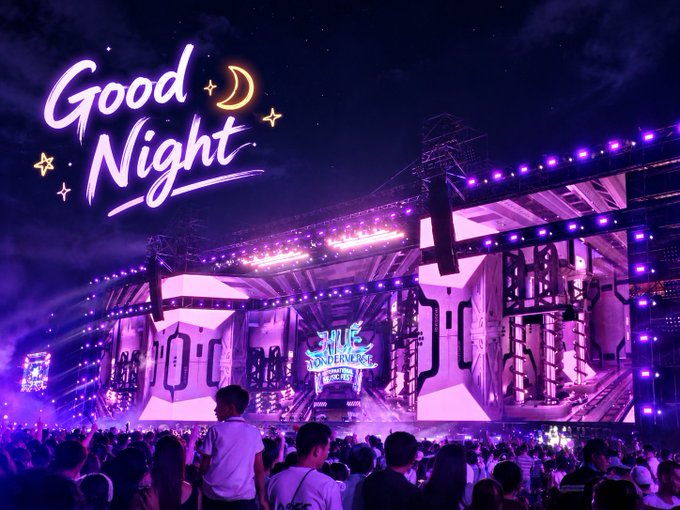 A nighttime concert festival scene features a large illuminated stage with the text 'Good Night' added in stylized purple font alongside a moon and stars overlay.