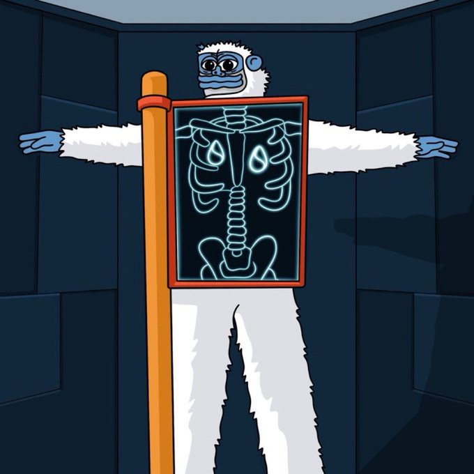 A cartoon illustration of a white yeti/monkey character strapped to an X-ray machine in a sci-fi chamber, with its skeleton glowing blue on the screen.