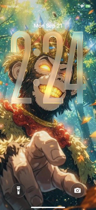 A phone lock screen showing a time of 2:24 on Mon Sep 21, featuring anime-style artwork of a crowned monkey with glowing eyes and golden teeth reaching its hand toward the viewer, with 'Verizon' and a 73% battery indicator visible.
