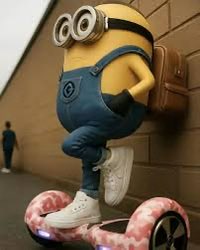 A blurry, motion-filled screenshot of a Minion from the Despicable Me franchise riding a bicycle very quickly through what appears to be a parking garage.
