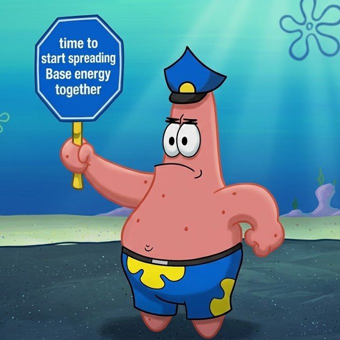 Patrick Star from SpongeBob SquarePants stands in his police uniform holding a sign that reads 'time to start spreading Base energy together'.