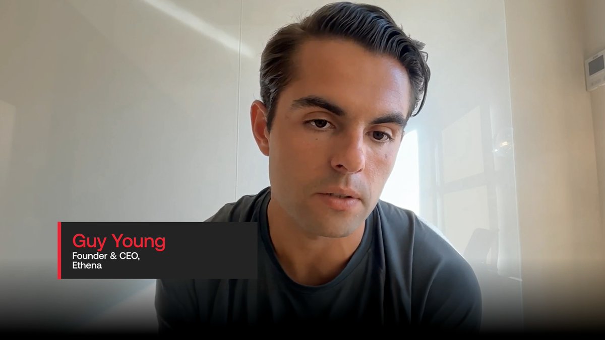 A man in a gray shirt against a white background, with a label identifying him as 'Guy Young, Founder & CEO, Ethena'.