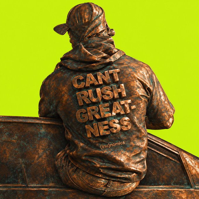 A bronze statue of a person wearing a hoodie and cap is viewed from behind against a bright green background, with the text "CANT RUSH GREATNESS" embossed on the jacket and "(inu)nomics" below it.