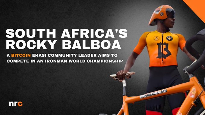 A promotional banner titled 'SOUTH AFRICA'S ROCKY BALBOA' features an athlete in an orange cycling outfit with a Bitcoin Ekasi logo, holding an orange bicycle with 'bitcoinekasi.com' visible on the frame.