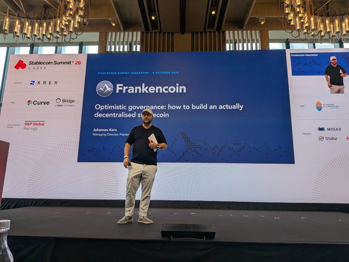 A presenter on stage at the Stablecoin Summit 2026 in Singapore discussing 'Frankencoin' and 'Optimistic governance: how to build an actually decentralised stablecoin' with Johannes Kern, Managing Director.