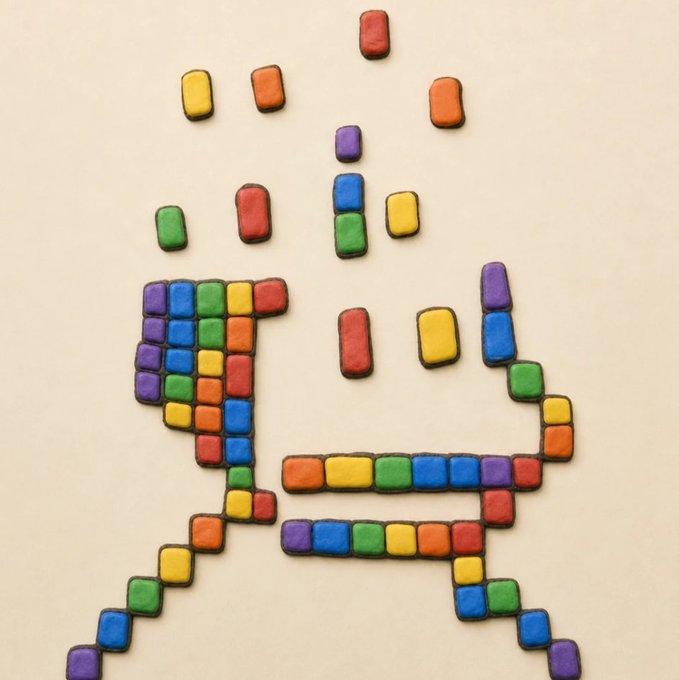 An artistic pixel-art style image created from small colored blocks forming the letter 'A' with colorful squares scattered above it.