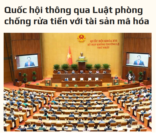 Vietnamese National Assembly session with the headline 'Quốc hội thông qua Luật phòng chống rửa tiền với tài sản mã hóa' (National Assembly passes Law on Anti-Money Laundering with digital assets), showing the parliamentary hall with the Vietnamese flag and national emblem.