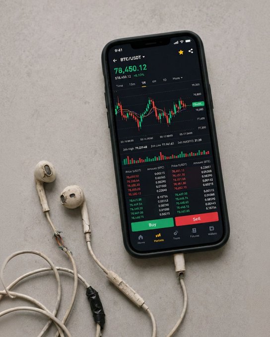 A smartphone displays a Bitcoin chart, with the ticker “BTC/USDT” and price “78,450.12,” beside worn wired earbuds. The exposed, frayed cable reinforces the caption “I hear colors through the exposed wire,” suggesting music travels through the damaged earphones.