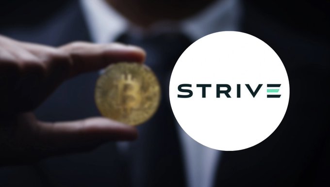 A hand holds a physical Bitcoin token in front of a suited figure, with the 'STRIVE' company logo displayed in a white circle on the right.