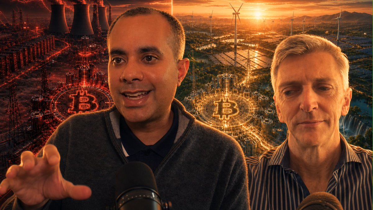 The image features two men sitting behind microphones, with one man wearing a gray sweater and the other wearing a striped shirt. They appear to be engaged in conversation or discussing something related to Bitcoin. The background shows an illustration of a city skyline at sunset, which adds a sense of depth and context to the scene.