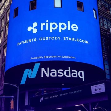 urns of a blue building with white text reading "Ripple" and "Payments, Custody, Stable Coin."