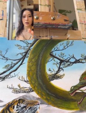 A split image shows a woman in a webcam view above and a fantasy illustration of a large green dragon and tiger below.