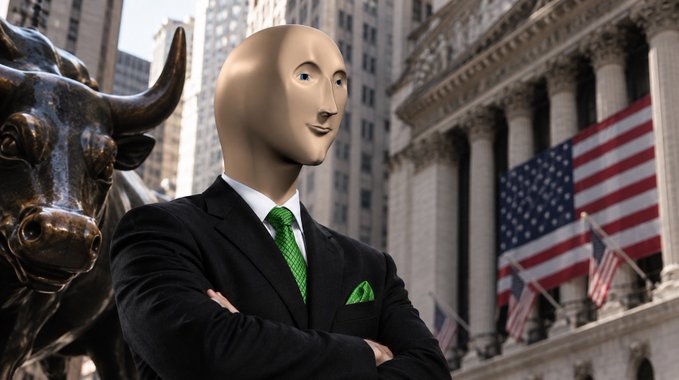 A figure wearing a beige mask, a black suit, and a bright green tie stands with arms crossed in front of a Wall Street building with American flags and a bronze bull statue.