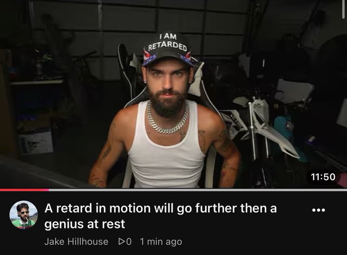 A YouTube thumbnail featuring a bearded man in a white tank top and a cap reading 'I AM RETARDED', with the video title 'A retard in motion will go further then a genius at rest' by Jake Hillhouse.
