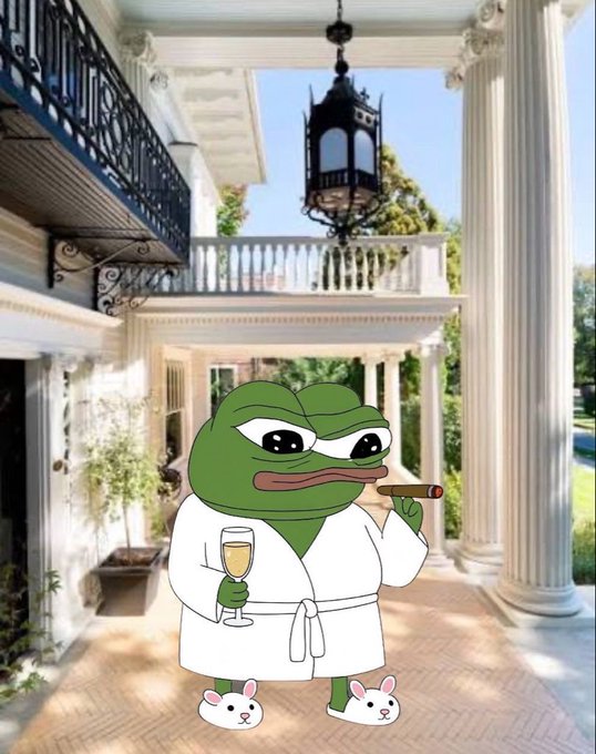 A cartoon Pepe the Frog wearing a white bathrobe and bunny slippers, holding a champagne glass and a cigar, superimposed in front of a luxurious mansion with white columns.