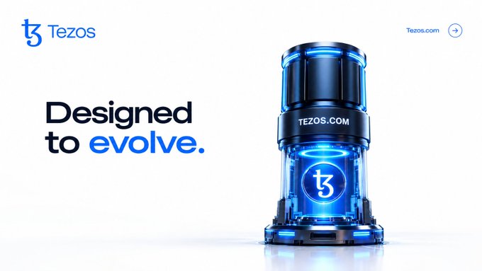 A promotional banner for Tezos cryptocurrency with the tagline "Designed to evolve," featuring the Tezos logo and a futuristic blue and black capsule-like device displaying "TEZOS.COM" and the Tezos symbol.