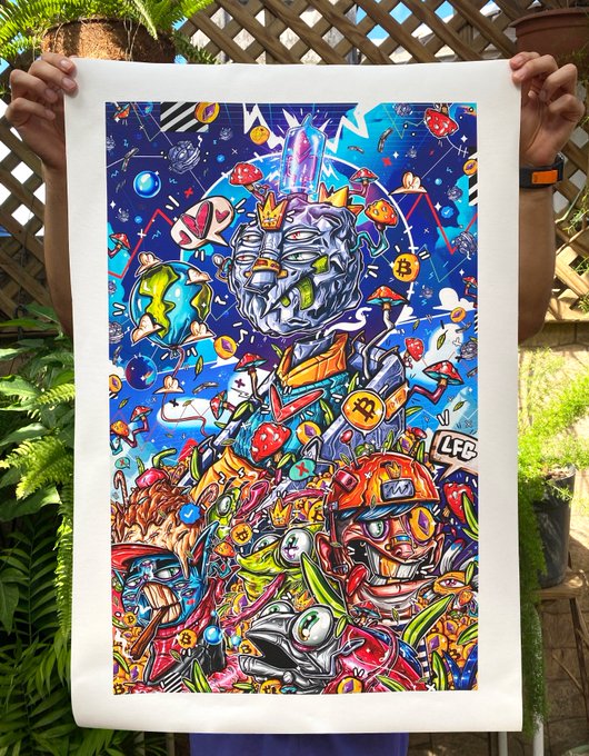 A colorful pop-art style poster or print being held up, featuring a crowned figure with metallic face, a Bitcoin symbol, and various cartoon elements with 'LFC' text visible.
