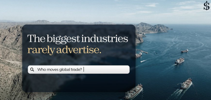 An aerial view of cargo ships navigating coastal waters near rocky islands, overlaid with text reading 'The biggest industries rarely advertise.' and a search bar showing 'Who moves global trade?', with a '$' symbol in the corner.
