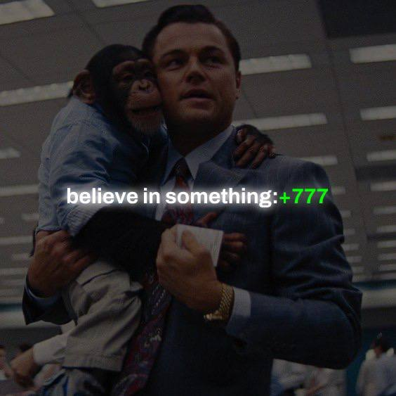 A meme featuring Leonardo DiCaprio holding a chimpanzee, overlaid with the text 'believe in something:+777' in white and green.