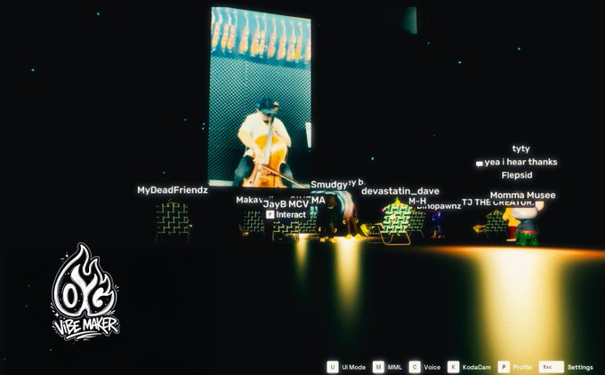 A screenshot from the 'Oye Vire Maker' game mode in Rec Room, showing avatars on a dark stage with a lit screen displaying a character in sunglasses.