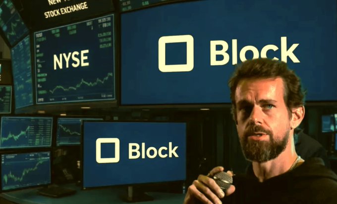 A man with a beard speaking into a microphone in front of multiple screens displaying the 'Block' logo (formerly Square) and the 'NYSE' (New York Stock Exchange) ticker with stock charts.