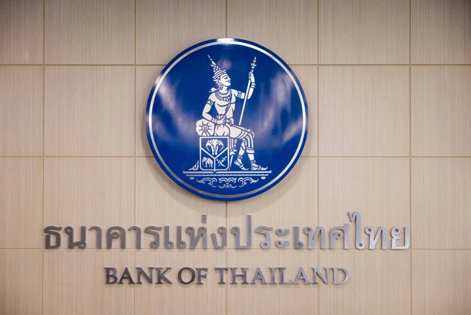 The image shows the official seal and signage of the Bank of Thailand, with both Thai script ("ธนาคารแห่งประเทศไทย") and English text ("BANK OF THAILAND") displayed on a tiled wall. The image directly relates to the post by visually representing the central institution mentioned that is partnering with the SEC to monitor USDT transactions and combat money laundering in Thailand.