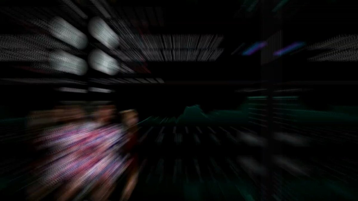 The image shows a close-up of a person wearing a pink shirt, with their face blurred out. The background appears to be black, but there are white lines that create an interesting effect due to motion blur. The focus of the image is on the person and their attire, while the surrounding elements seem to be in the background or slightly out of focus.