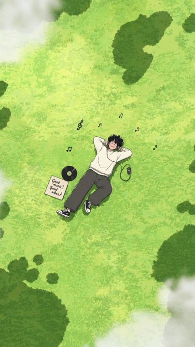 An anime-style illustration of a person with dark hair lying on green grass listening to music with headphones, surrounded by floating musical notes, with a vinyl record and handwritten note beside them.