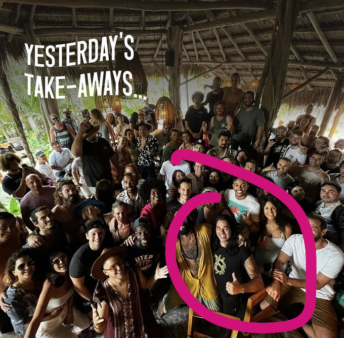 The image shows a large group of people posing together in an open-air thatched-roof structure, with the text "YESTERDAY'S TAKE-AWAYS..." displayed in the upper left corner. Two individuals are circled in pink—one wearing a yellow shirt and another with long dark hair giving a thumbs-up—which aligns with the post about meeting Didi Taihuttu and his family on a beach in Tulum, highlighting a personal encounter with the Bitcoin pioneer featured in the post.