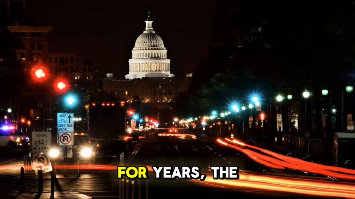 The image shows a city street at night with traffic lights, buildings, and a large white building with a dome that has "For Years" written above it. The text also mentions Ripple XRP as a potential national reserve asset, which could be an indication of a significant shift in financial history.