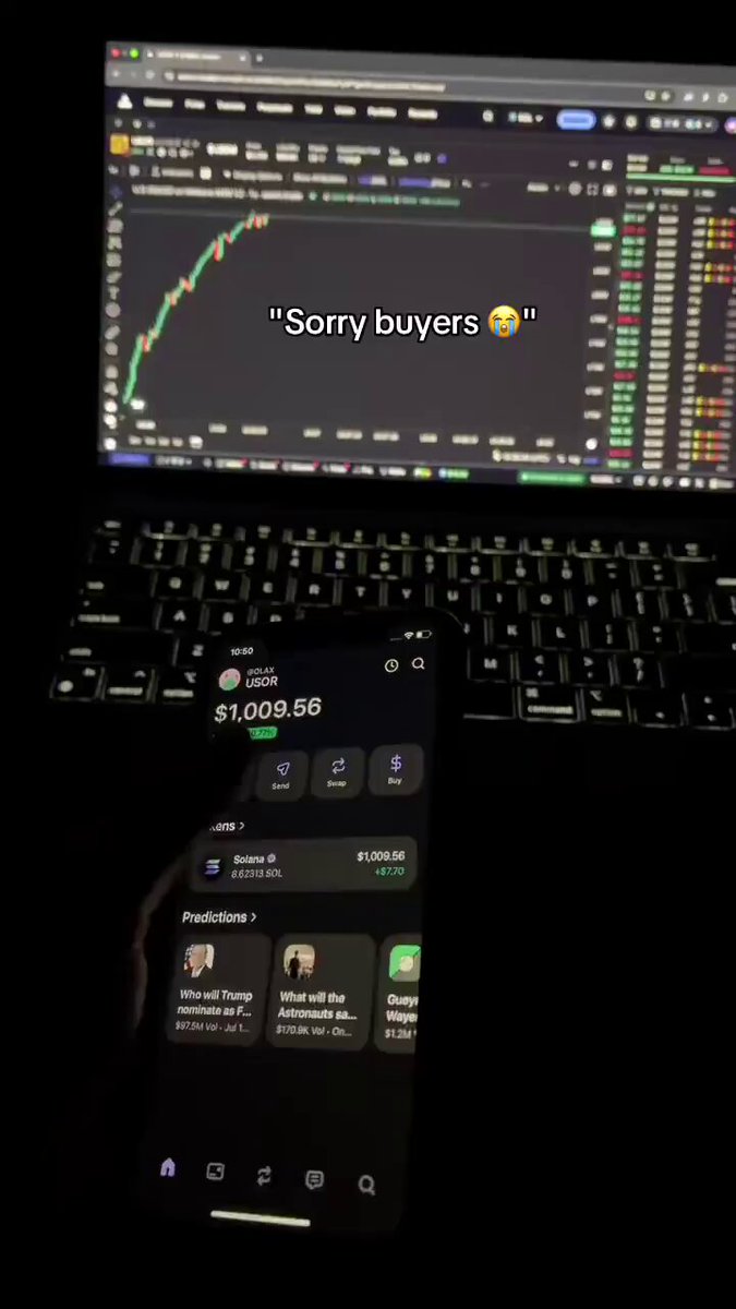 The image shows a person holding a cell phone displaying an app called "Investors" with a message that says "Sorry buyers", which seems to be related to Bitcoin trading. The person appears to be using their laptop, possibly for research or monitoring the Bitcoin market. The text in the image suggests that the person is proud of their Bitcoin investments and wants to brag about it.