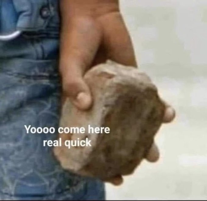 A child in denim overalls holds out a large rock with the caption 'Yoooo come here real quick'.