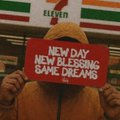 A meme image showing a person holding a red sign with white text reading 'NEW DAY NEW BLEEDING SAME DREAMING', with a 7-Eleven sign visible in the background.