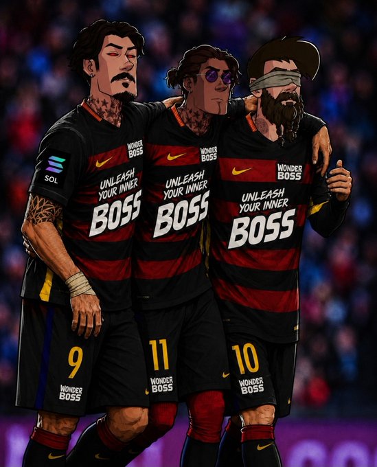The image features three soccer players wearing black and red jerseys, standing together with their arms around each other's shoulders. They are posing for a picture, likely after scoring a goal or celebrating a win. The background of the photo shows a crowd watching the game from behind them.